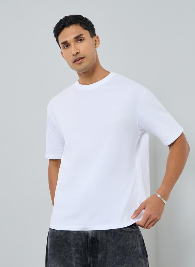 ستايلي تيشيرت جيرسي ثقيل بقصة واسعة وطبعة شعار - Image 2